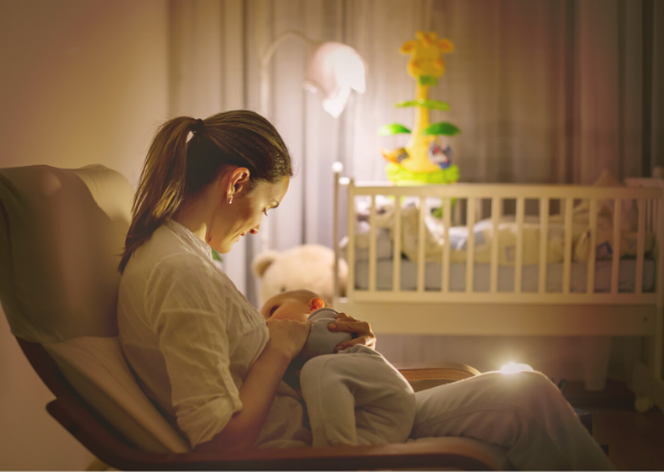 Woman breastfeeding at night