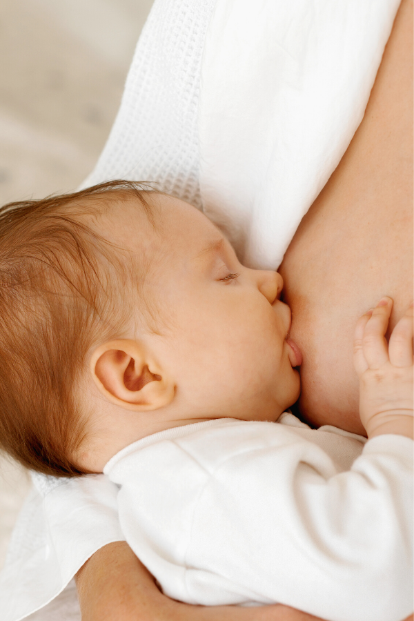 baby breastfeeding on a new mom