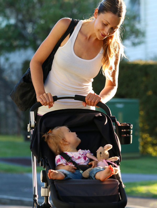 Woman walking baby in stroller